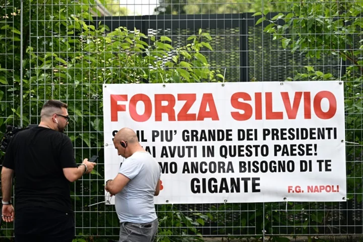 Berlusconi fans gather at hospital to mourn 'immortal' icon