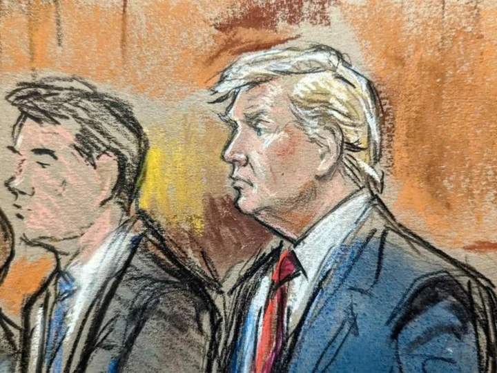 Notepads, students, and a pay phone: How CNN broke the news from Trump's arraignment despite a courtroom ban on electronics