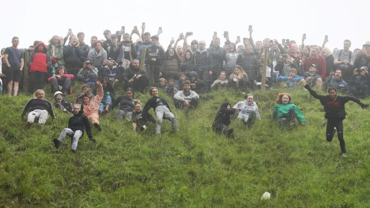 Canadian Woman Wins First Prize in Cheese-Rolling Race After Knocking Herself Unconscious
