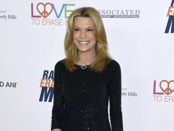 Vanna White extends her time at the puzzle board on 'Wheel of Fortune' for two additional seasons