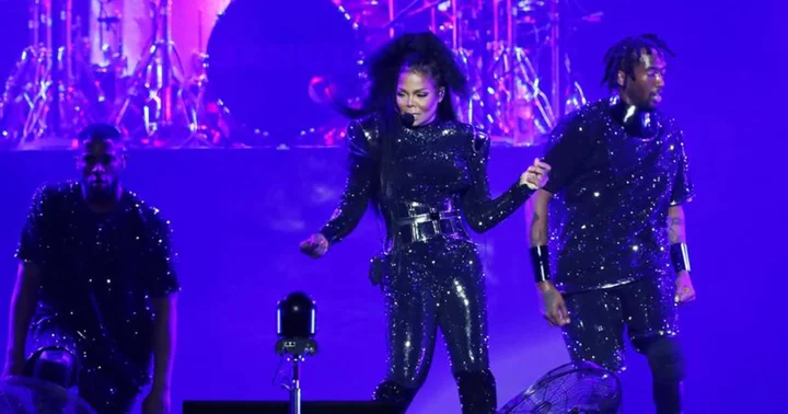 Janet Jackson moves hands over backup dancer Mariusz Kotarski's crotch at Pennsylvania concert