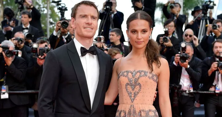 Alicia Vikander dazzles in pink gown as she makes rare appearance with husband Michael Fassbender at Cannes