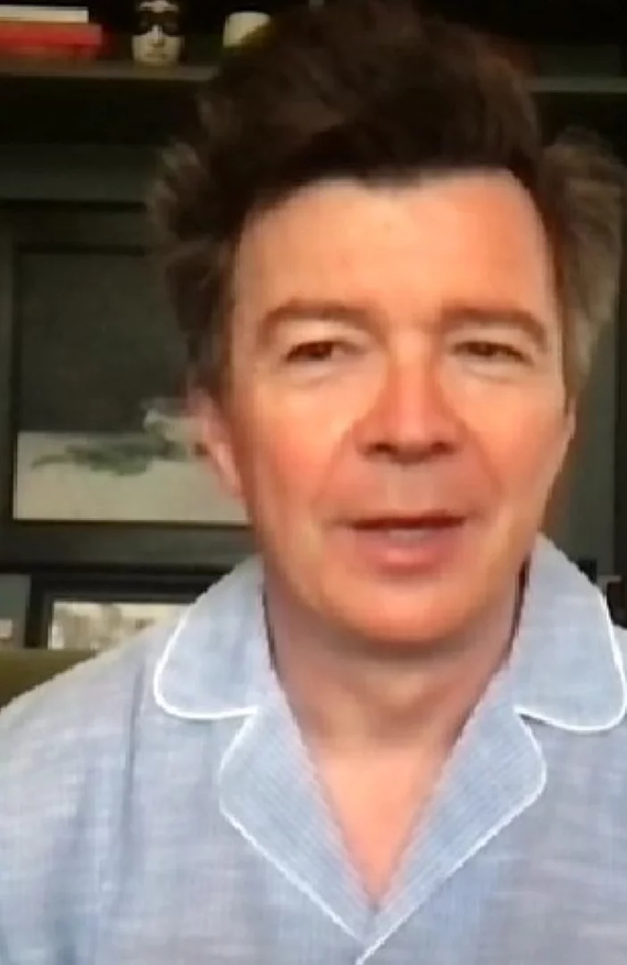 Rick Astley does interview in his Pyjamas and jokes he'll rock them on Glasto stage
