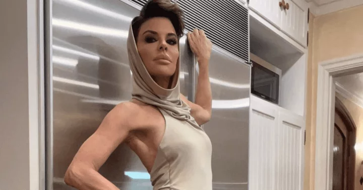 'Kitchens are for selfies': Internet jokes as Lisa Rinna flaunts 'chic comfy fashion' in hooded jersey maxi dress