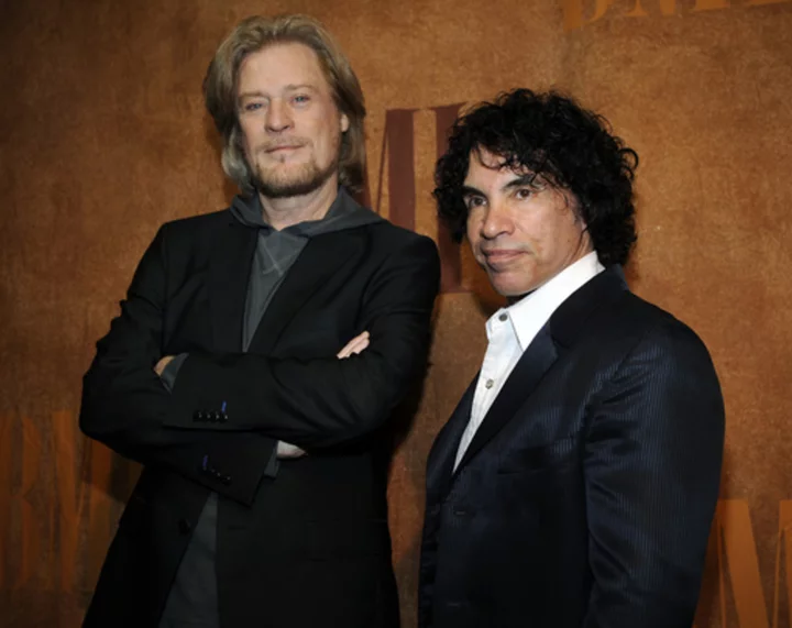Daryl Hall is suing John Oates over plan to sell stake in joint venture. A judge has paused the sale