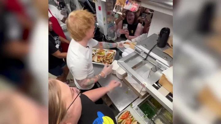 Ed Sheeran spotted serving hotdogs in Chicago - and gets brutal telling off from staff