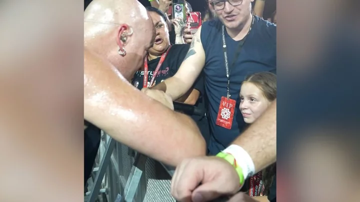 Metal singer halts show after accidentally scaring young girl in front row