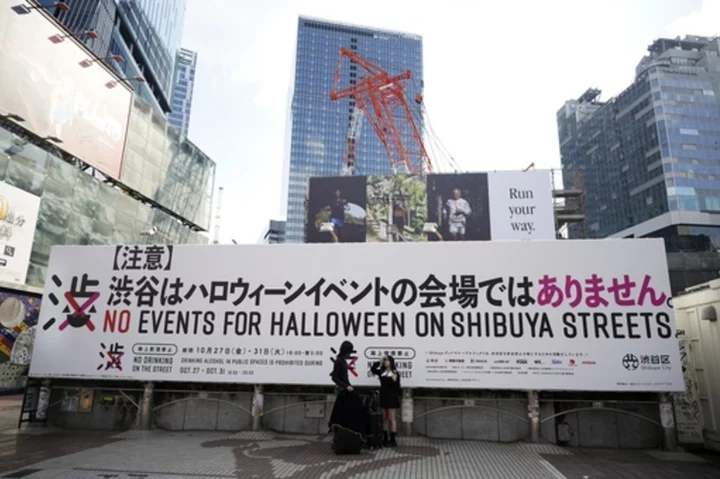 Tokyo's Shibuya district raises alarm against unruly Halloween, even caging landmark statue