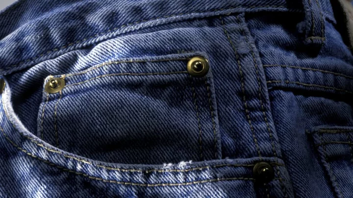 The Riveting Reason Blue Jeans Have Those Little Metal Studs Over the Pockets