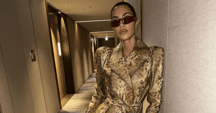 Kim Kardashian slammed for flaunting 'fancy' leopard print coat as she shares vacation memories with daughter North West