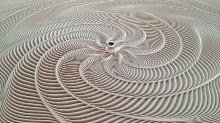 Hypnotic Coffee Table Creates Sand Art With a Magnetic Marble