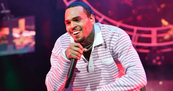 How tall is Chris Brown? Rapper towers over peers with his imposing presence