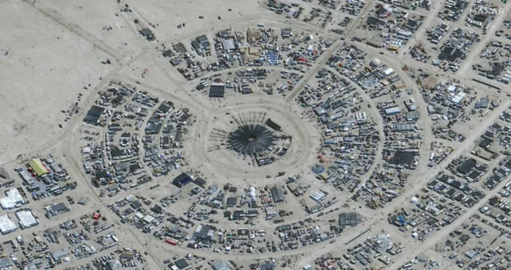 Desert rain leaves thousands stranded in muddy mess at Burning Man
