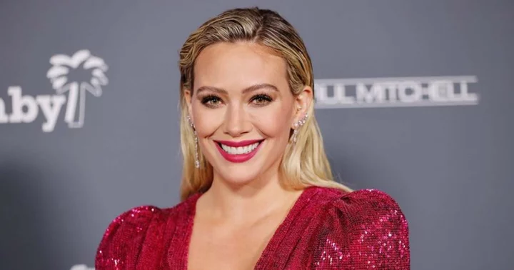 Hillary Duff hits back at trolls spreading rumors of her being pregnant after she wore a baggy sweater for ad