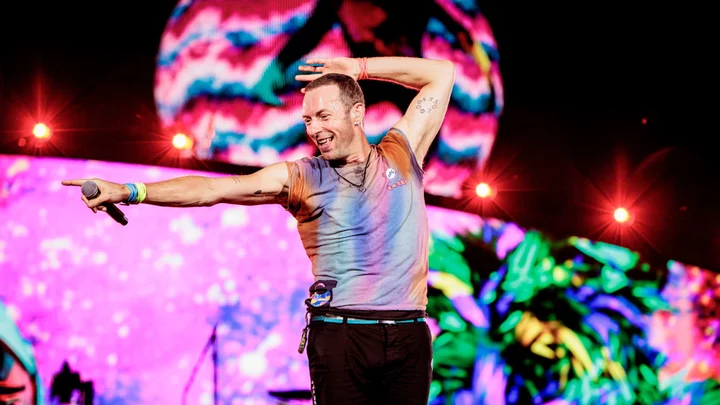 Chris Martin serenading Dakota Johnson during his Coldplay concert