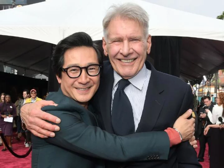 Ke Huy Quan reunites with Harrison Ford on 'Indiana Jones' red carpet