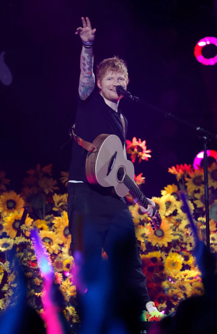 Ed Sheeran performs with child musicians in Boston