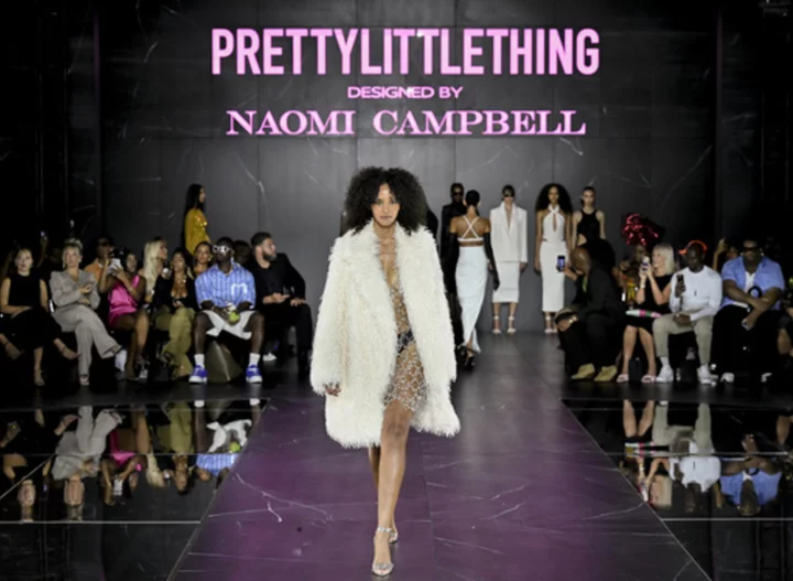 FASHION PHOTOS: Naomi Campbell struts the runway in shimmery silver in new fast fashion collab