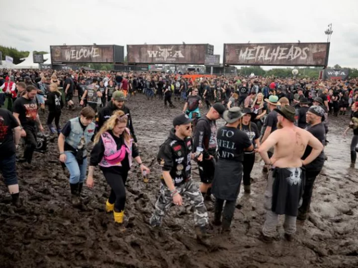 German heavy metal festival halts admissions as rain turns site to mud