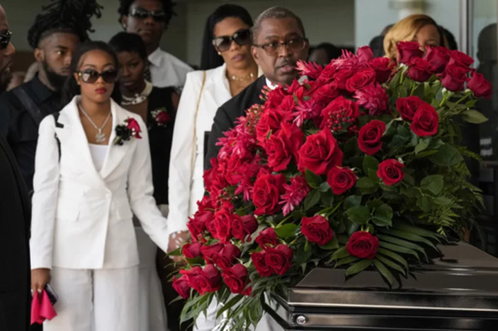 Friends and family gather for the funeral of Houston rapper Big Pokey