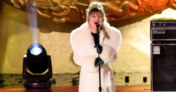 Kelly Clarkson wows in white at Rockefeller Center's Christmas Tree Lighting event as fans obsess over her fur trimmed coat