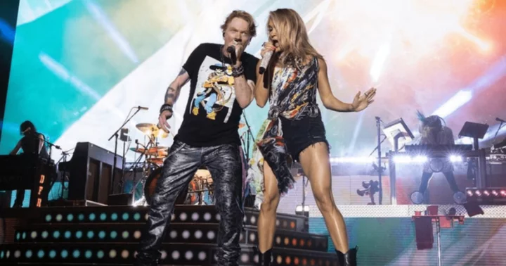 Axl Rose helps pal Carrie Underwood pick out stadium anthems for her opening act at 'Guns N Roses' concert