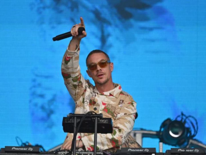 Diplo hitchhiked ride out of rain-drenched Burning Man after walking miles 'through the mud' and actually made it to his DC concert