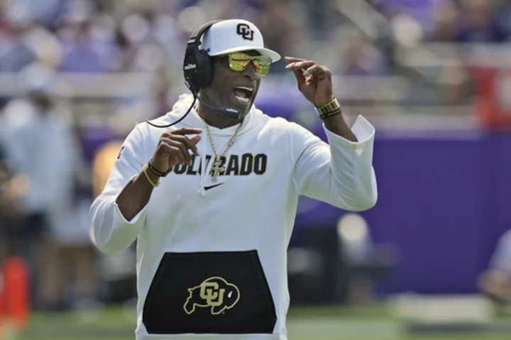 Deion Sanders makes most of rival coach's comments about him always wearing sunglasses and a hat