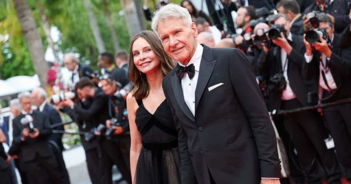 'This deserves an Oscar': Harrison Ford's sneaky adoring stare at wife Calista Flockhart in cheeky snap sparks meme fest