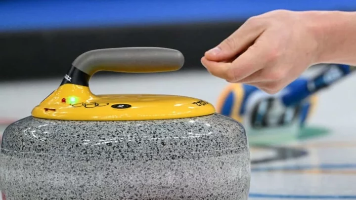 What Are Those Red and Green Lights on Curling Stones?