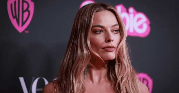 Margot Robbie glams it up in Versace pink dress showcasing her stunning figure at Barbie-themed bash