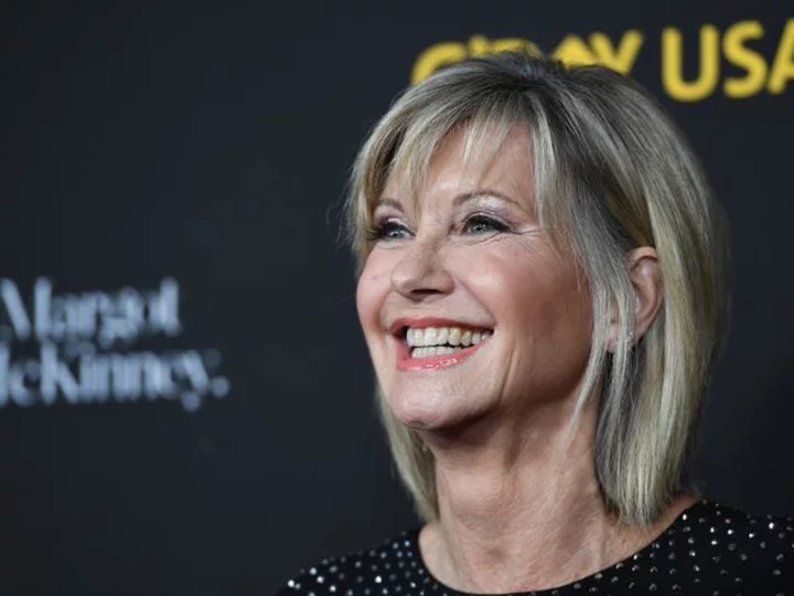 Olivia Newton-John's husband and daughter say she's visited them as a 'blue orb' since dying